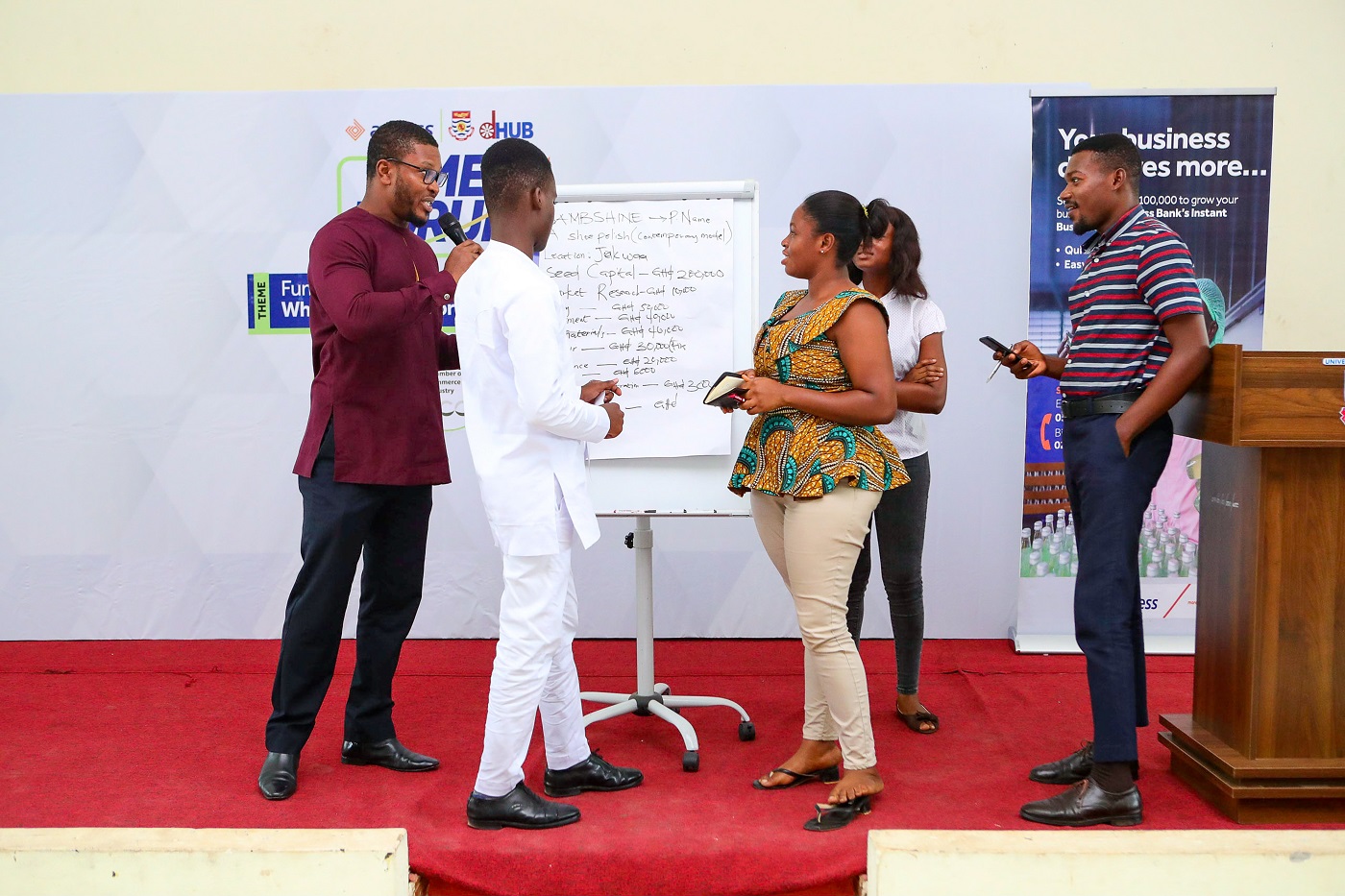 A facilitator analysing a presentation by some participants