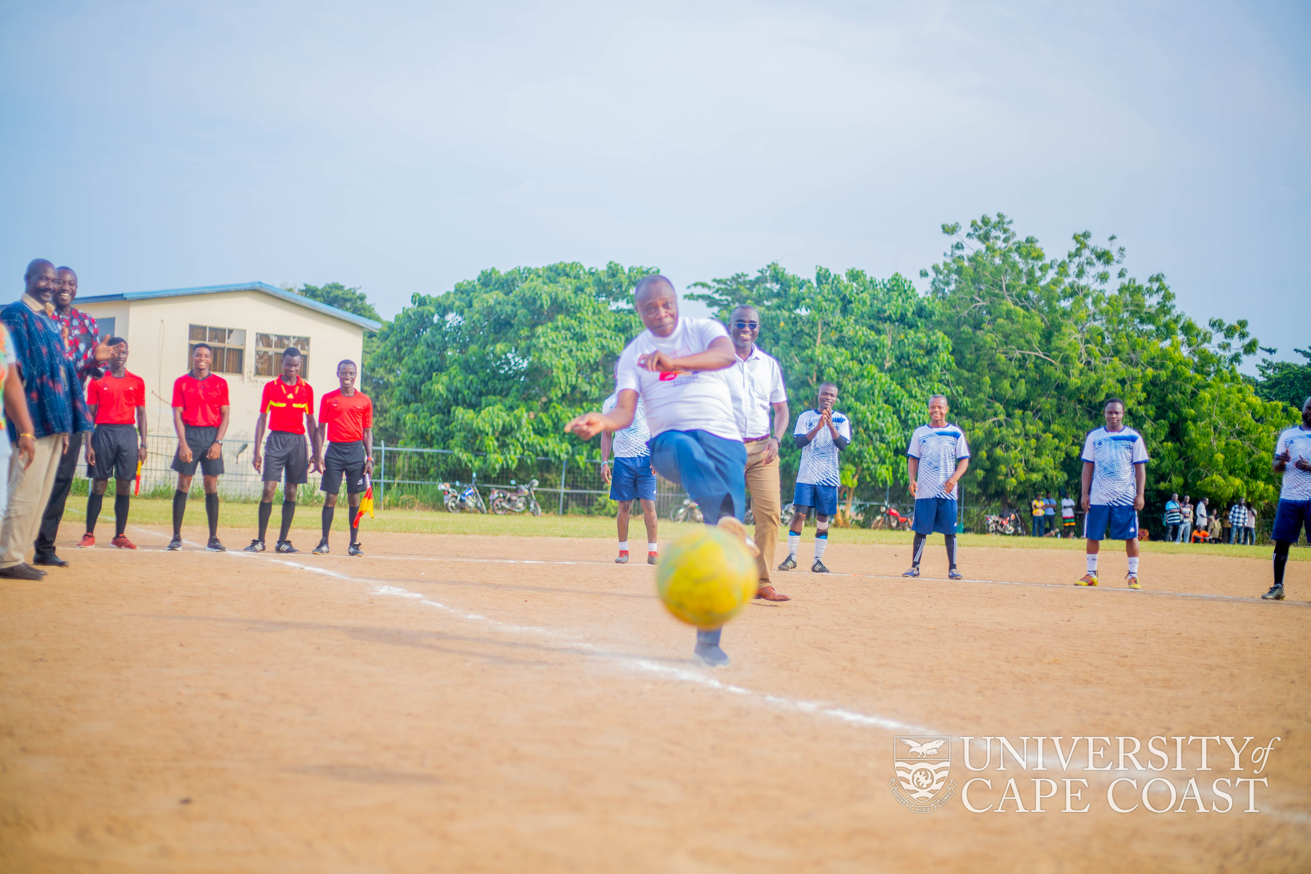 Prof. G. K. T. Oduro kicking a football to commence the final match of the 2022 Staff Games Prof. G. K. T. Oduro kicking a football to commence the final match of the 2022 Staff Games