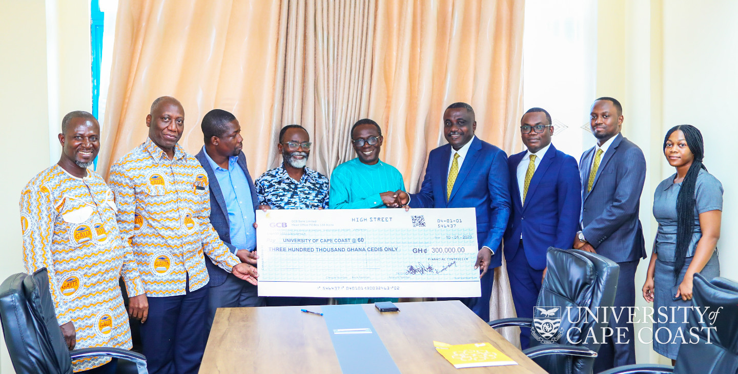 UCC officials receiving the dummy cheque from GCB-bank delegation. UCC officials receiving the dummy cheque from GCB-bank delegation.
