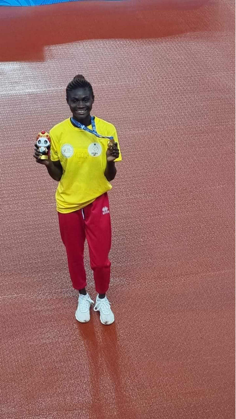 Rose Amoaniwaa Yeboah displaying her gold medal