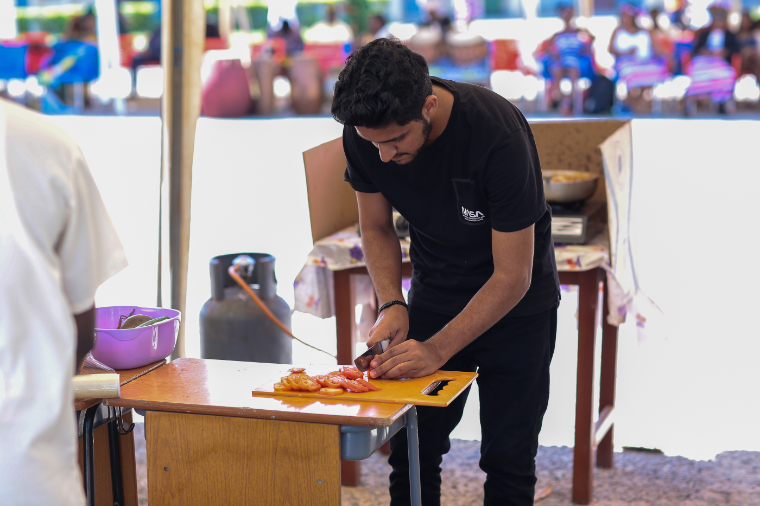 A Pakistani student at UCC preparing a native dish from his country