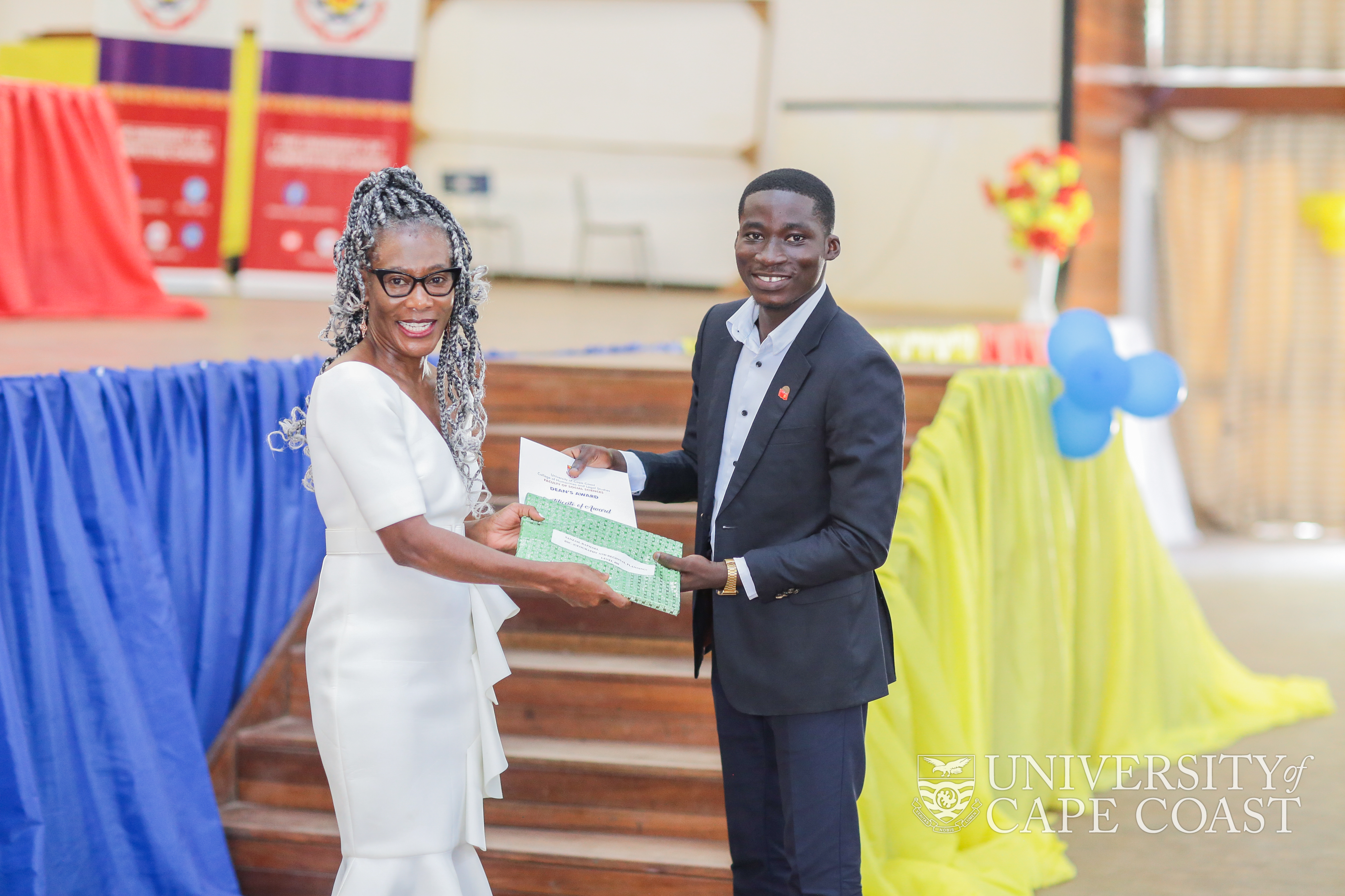 Prof. Victoria Time presenting an award to a first class student