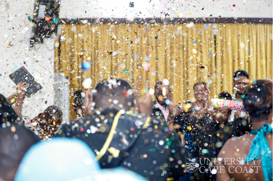 The final-year students popping some confetti to celebrate the completion of their first degree