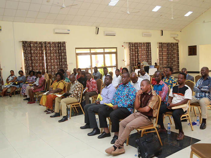 Participants listening to presentations at the workshop