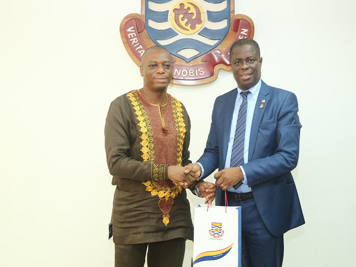 Prof. Joseph Ghartey Ampiah presenting UCC branded souvenir to Dr. Kingsley Nyarko Prof. Joseph Ghartey Ampiah presenting UCC branded souvenir to Dr. Kingsley Nyarko