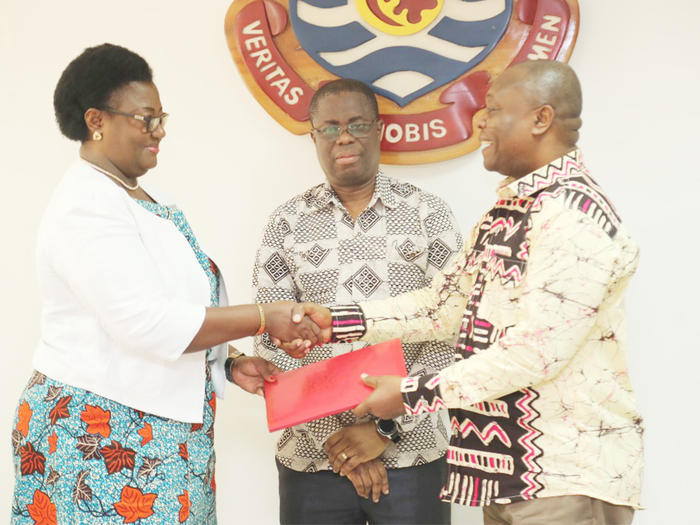 New Pro Vice-Chancellor, Prof. Dora Edu-Buandoh receiving the handing over notes from Prof. George K. T. Oduro