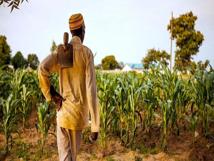 Small holder farmer on his way to the farm