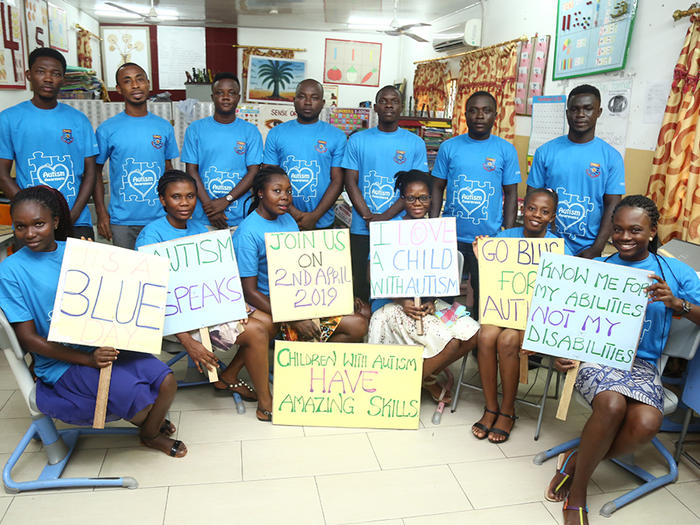 Volunteers of CCDRR displaying placards