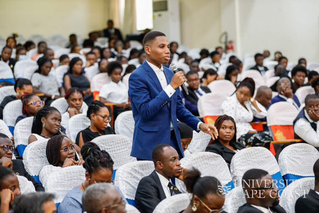 A student posing a question at the confab